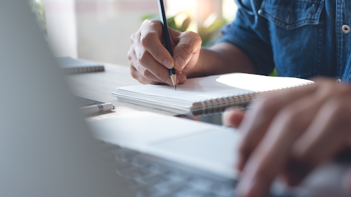 Writing in a note pad